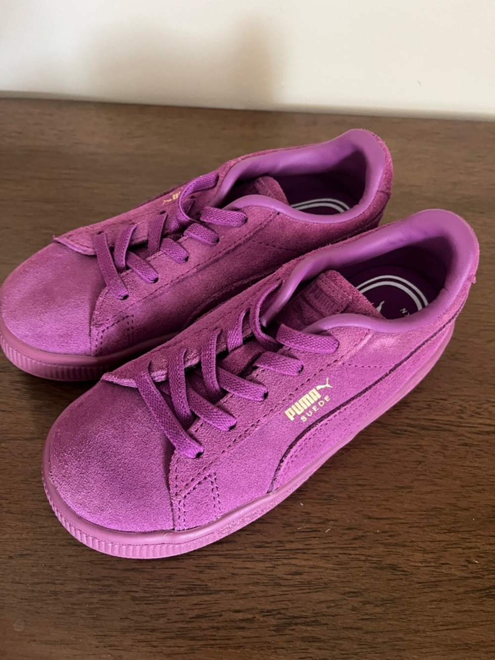 Puma Kids Suede Sneaker in Vibrant Purple with Gold Logo